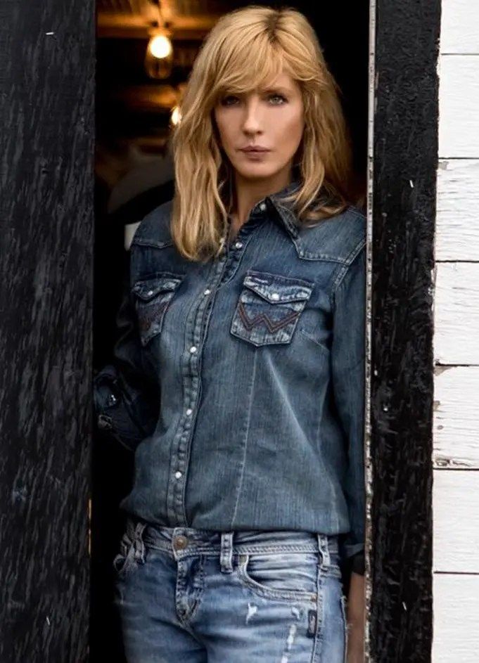 a woman standing in the doorway of a building