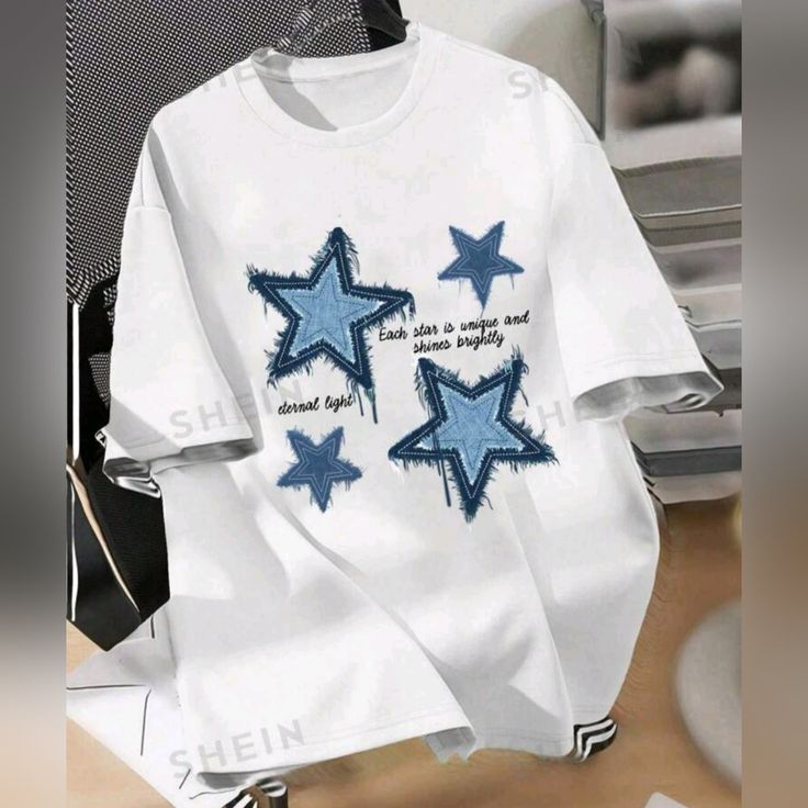 Ladies White Graphic T-Shirt With Blue Stars Size Medium By Shein Polyester Cotton And Elastane Fabric Brand New Trendy Blue Top With Star Print, Trendy Blue Star Print Top, Casual Relaxed Fit Tops With Star Print, White Relaxed Fit Top With Star Print, Casual White T-shirt With Star Print, Casual Short Sleeve Top With Star Print, White Star Print Short Sleeve Top, Trendy White Tops With Star Print, Casual Crew Neck T-shirt With Star Print