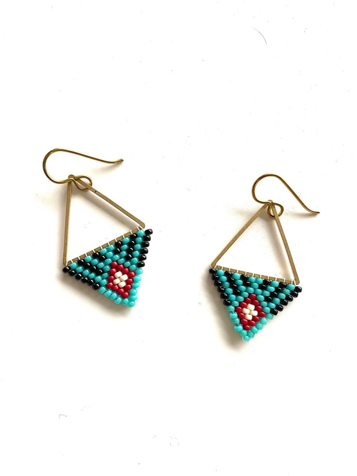 two pairs of beaded earrings with triangle shapes on the front and back ends, one is