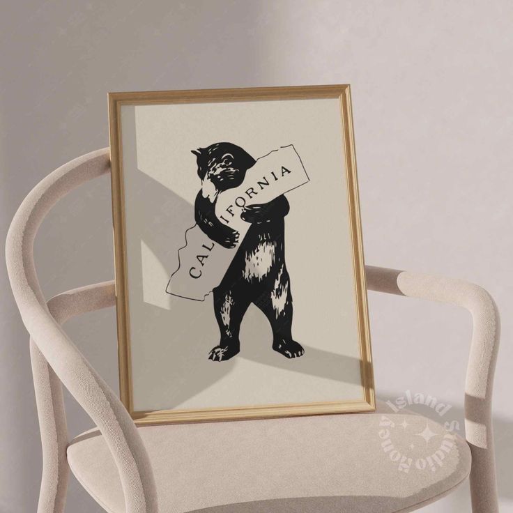 a black and white bear holding a sign that says annoan on it's chest