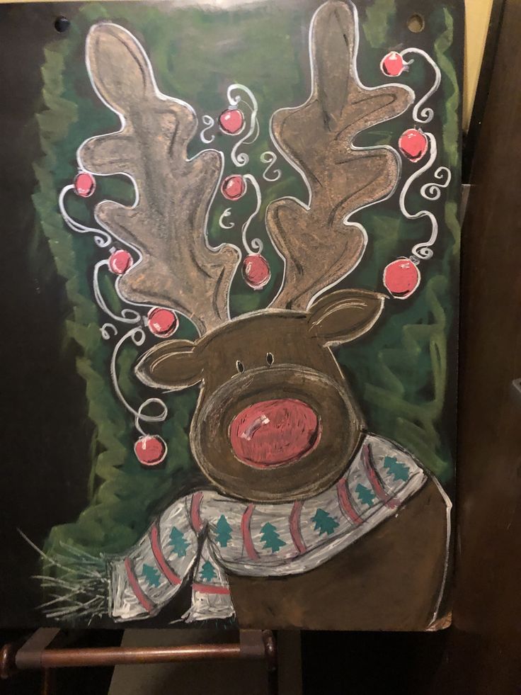 a painting of a reindeer with red berries on it's antlers and nose