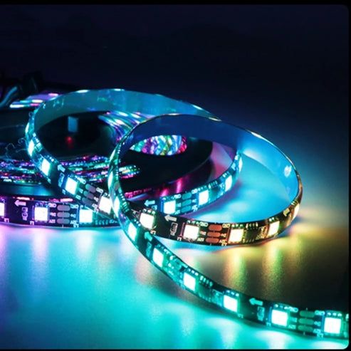 three different types of led strip lights on a dark surface with blue and green lighting