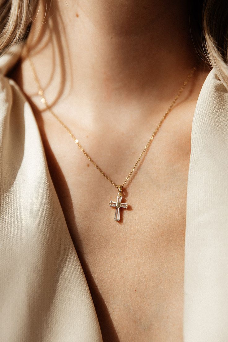 Maximize your style with the Ophelia Diamond Cross Necklace - a statement piece that is both water and tarnish resistant. Perfect for stacking, this beautiful cross necklace will take your look to the next level. Crafted with care, so you can make it an everyday staple. MATERIAL: 18k PVD Gold plated, Stainless steel, Cz LEGNTH: 18" Water resistant, tarnish resistant, hypoallergenic, & nickel/lead free. Luxury Elegant Cross Necklace, Wedding Cross Necklace, Cross Necklace Aesthetic, Golden Cross Necklace, Gold Cross Necklace For Women, Gold Diamond Cross Necklace, Diamond Cross Earrings, Diamond Cross Necklace Gold, Dainty Cross Necklace