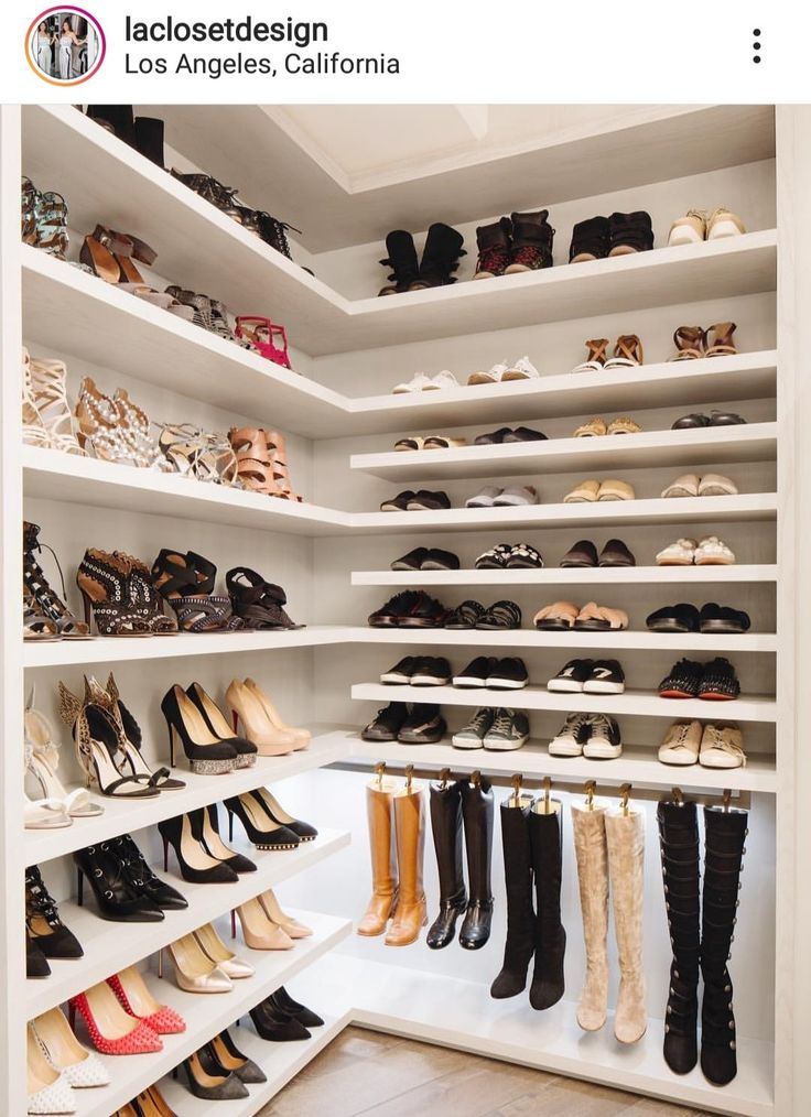 a walk in closet filled with lots of shoes and high heeled boots on shelves