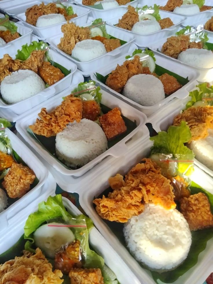 several trays filled with different types of food on top of each other in plastic containers