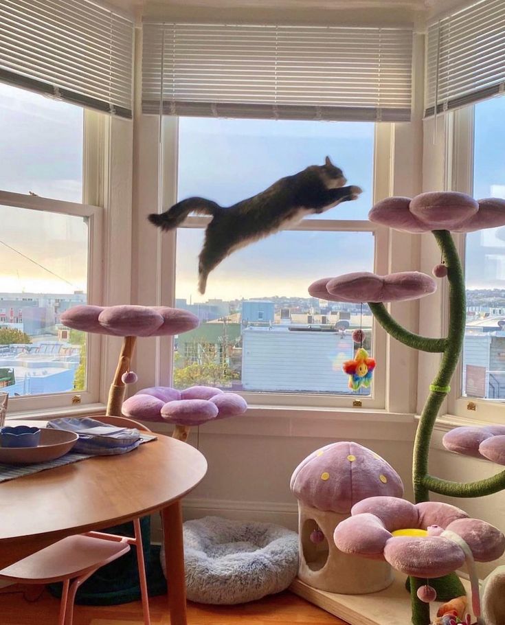 a cat jumping up into the air from a window in a room filled with mushrooms