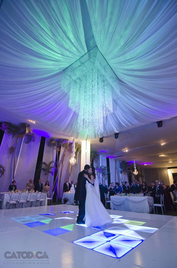 a bride and groom sharing their first dance