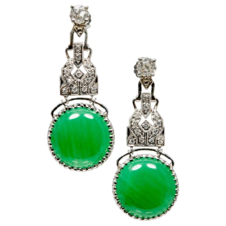 Jade and diamond dangle earrings set in handmade platinum. Well cut old mine diamonds on the top with pave accent diamonds. Certified natural untreated undyed green Jadeite Jade drops. Each one is GIA certified. 1 round cabochon cut Jadeite Jade GIA # 10880421 16.50cts. 1round cabochon cut Jadeite Jade GIA# 10880420, 16.22cts. 2 old mine cut diamonds 1.21cts. 24 round diamonds .24cts. Tested platinum. 16.4 grams. 1 5/8 x 11/16 inch. Platinum Earrings, Diamond Dangle Earrings, Jade Earrings, Jade Carving, Jade Jewelry, Diamond Drops, Pear Shaped Diamond, Gold Earrings Dangle, Gems Jewelry