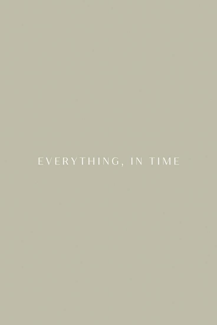 the words everything in time are written on a gray background with white lettering that says everything in