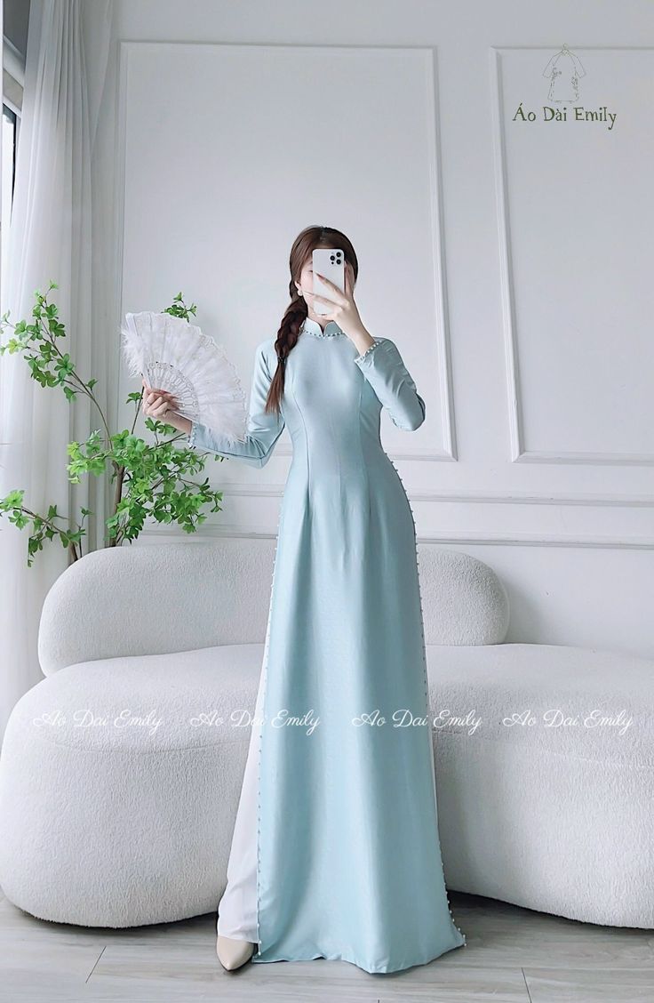 🌻Material: Lụa vân gỗ 🌻Stretchy level: 2/10 🌻 The measurement of this ao dai (long dress) is in Vietnamese size (American size tends to be bigger for the same size). Please LOOK AT THE SIZE CHART CAREFULLY BEFORE ORDERING. There might have some chalk writings on the fabric due to making process. These marks can be washed away easily. 🌻🌻No returns or exchanges Buyer can contact seller about any issues with an order. 🌸 Follow us Facebook/aodaiemily www.aodaiemily.com 💜 Thank you very much💜 Long Dress Wedding, Day Checklist, Wedding Day Checklist, Vietnamese Clothing, Modern Qipao, Vietnamese Dress, Stylish Work Attire, Work Attire, Dress Wedding