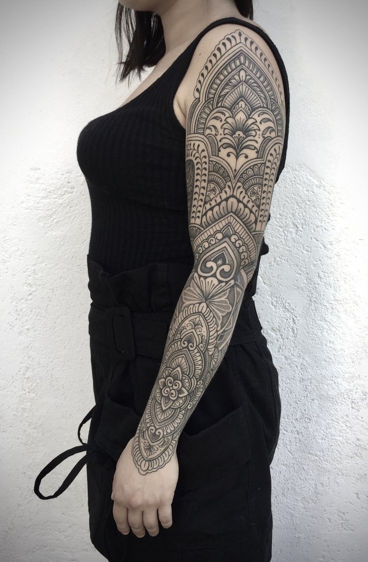 a woman with a tattoo on her arm