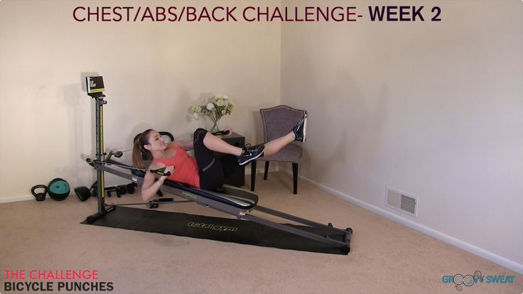 a woman is doing an exercise on a rowing machine