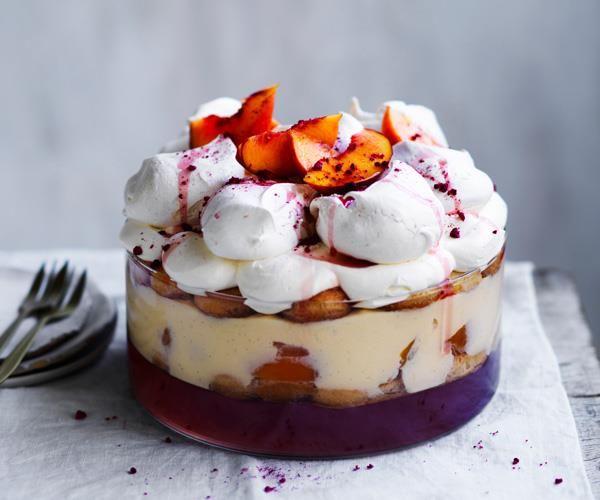 a dessert with whipped cream and fruit on top