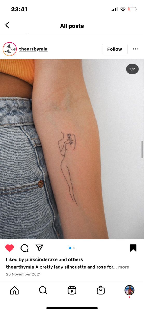 a woman's arm with a small tattoo on the left side of her arm