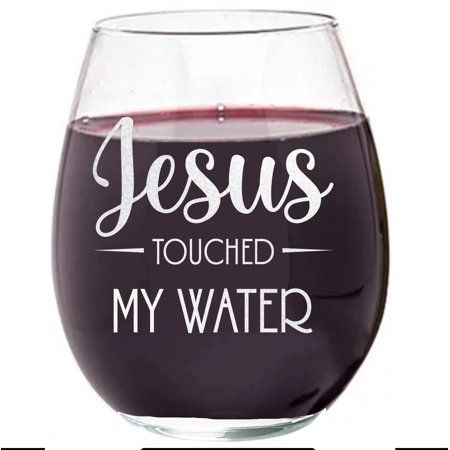 a wine glass with the words jesus touched my water