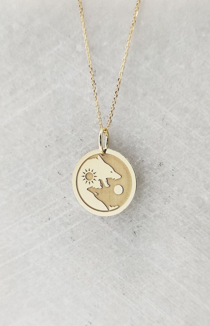 9K Real Solid Gold Necklace, Hallmarked on the back of your pendant for certification! ▪️ A beautiful and clean engraved Yin Yang Wolves pendant made out of 9K Solid Real Gold. Available only in yellow gold! Pendant Thickness: 0.50mm Jump Ring inner diameter: 4mm Dimensions: - 13mm / 0.52 inches - 15mm / 0.59 inches - 18mm / 0.70 inches - 20mm / 0.78 inches - 22mm / 0.86 inches - 24mm / 0.94 inches Necklace Length - You can choose your chain length from 35CM to 50CM. The pendant is available alo Yin Yang Jewelry, Howling Wolves, Yin Yang Necklace, Wolves Pendants, Wolf Necklace, Wolf Jewelry, Solid Gold Necklace, Necklace Personalized, Coin Necklace