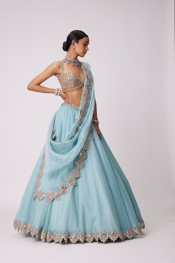 Powder Blue Organza Real Hand-Cut Mirror Embroidered Lehenga And Dupatta Clubbed With a Heavily Mirror embellished sleeveless blouse.From Vvani Vats Jugmug's collection.DELIVERY TIMEPlease allow 8-12 weeks for your outfit to arrive.FABRIC DETAILSLehanga - Organza Dupatta - OrganzaBlouse - GeorgetteProfessional cleaning only. Blue Organza Lehenga, Blue Organza, Organza Lehenga, Mirror Embroidery, Blue Lehenga, Indian Dresses Traditional, Embroidered Lehenga, Dupatta Set, Organza Dupatta