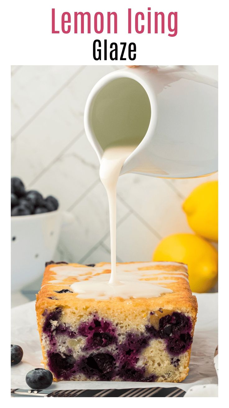 lemon icing glaze being poured onto a blueberry cake with fresh blueberries in the background