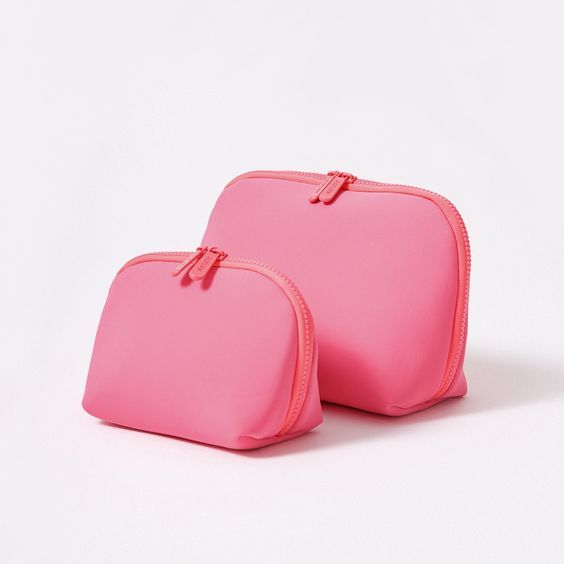 This pouch set is here to help you organize your daily essentials and make travel a little easier. With two compact pieces, everything will be neatly zipped up and perfectly organized. Plus, these pouches are machine washable, adding convenience to your organizational bliss. Pink Rectangular Travel Accessories For On-the-go, Pink Pouch With Zipper Pocket For On-the-go, Pink Pencil Case With Removable Pouch For Travel, Pink Rectangular Travel Accessories With Zipper Closure, Pink Rectangular Travel Accessories With Zipper, Pink Cosmetic And Toiletry Pouch For Everyday Use, Pink Everyday Cosmetic And Toiletry Storage Pouch, Pink Cosmetic And Toiletry Storage Pouch, Pink Pouch For Daily Use Cosmetic And Toiletry Storage