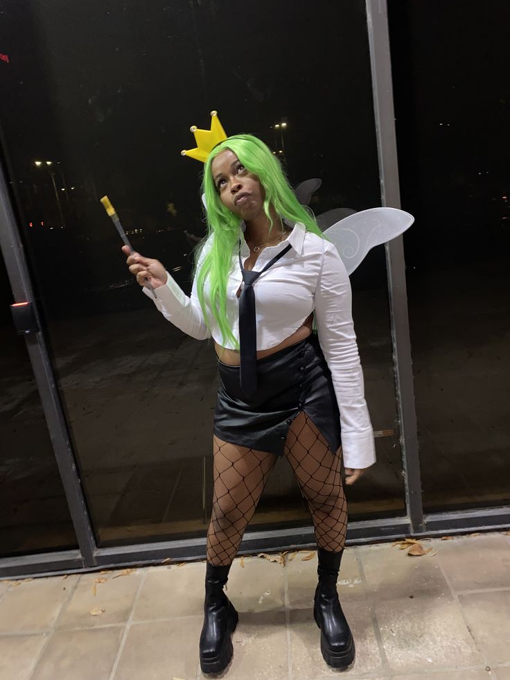 a woman dressed up as a fairy holding a wand