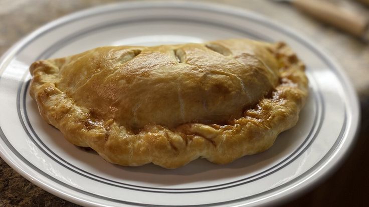 a piece of pie on a white plate