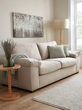 a living room scene with focus on the couch and coffee table in the foreground