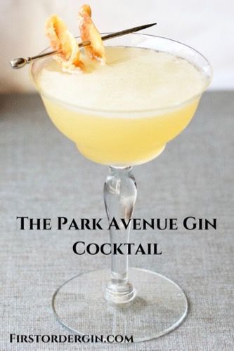 the park avenue gin cocktail is served in a coupe glass with an orange peel garnish