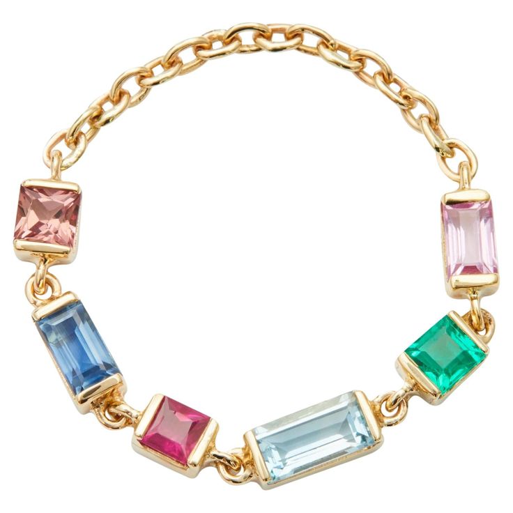 Add some color to your life with our gold rainbow chain ring. Featuring multicolored gemstones, you will absolutely love this one! It shows the natural allure and effortless luxury of our chain rings. Each setting has been carefully handmade for this modern design. Get a taste of every color - this ring has it all! Our signature chain rings look incredibly delicate by itself or stacked with one of our other creations. Each ring is a unique combination of sapphires, emerald, ruby and aquamarine. Luxury Hand Set Multicolor Jewelry, Luxury Chain Ring Jewelry, Luxury Polished Chain Ring, Luxury Modern Chain Ring, Luxury Fine Jewelry Chain Ring, Luxury Collectible Ruby Ring With Gemstone, Luxury Collectible Ruby Gemstone Ring, Luxury Multicolor Hand-strung Jewelry, Luxury Multicolor Trendy Jewelry