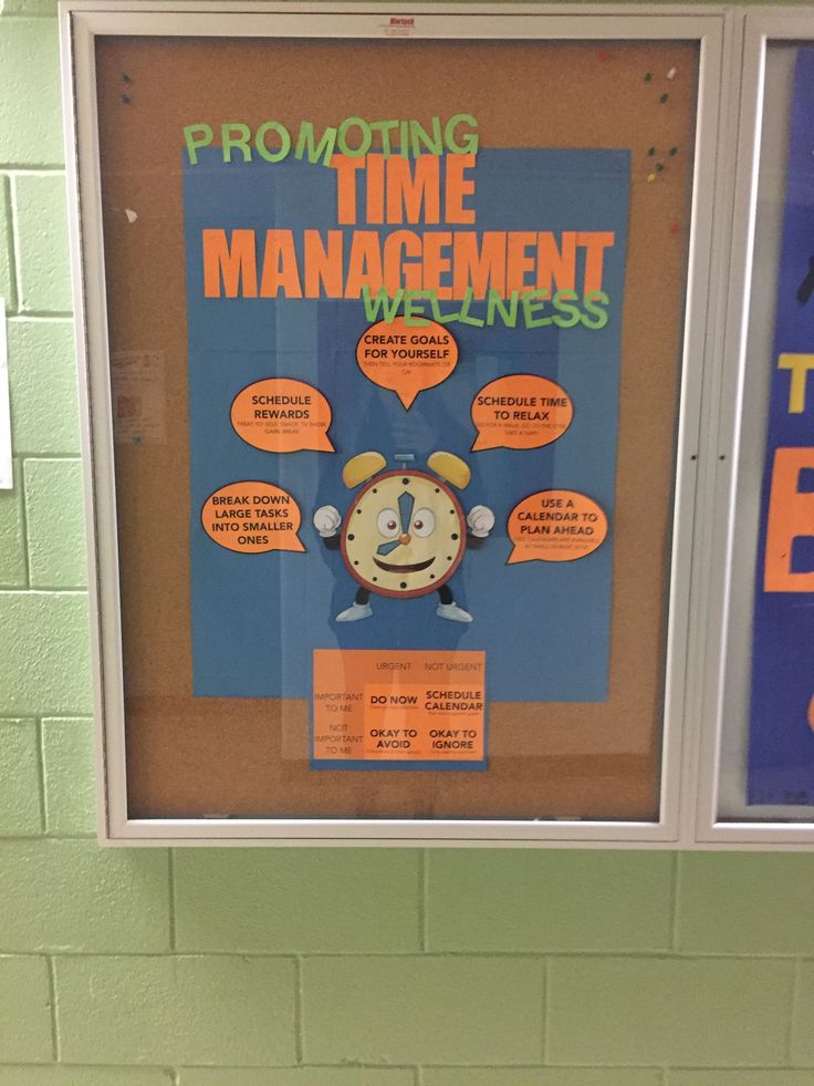 a bulletin board with an alarm clock on it