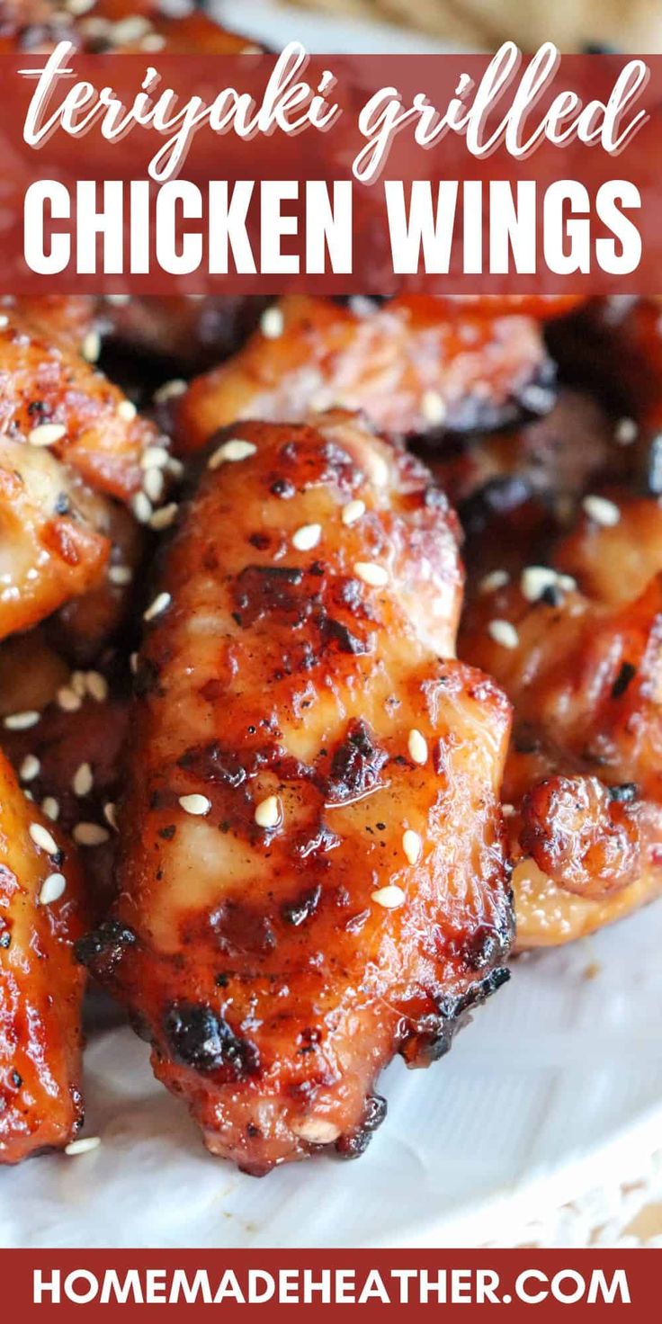 teriyaki grilled chicken wings on a plate with sesame seeds and ketchup