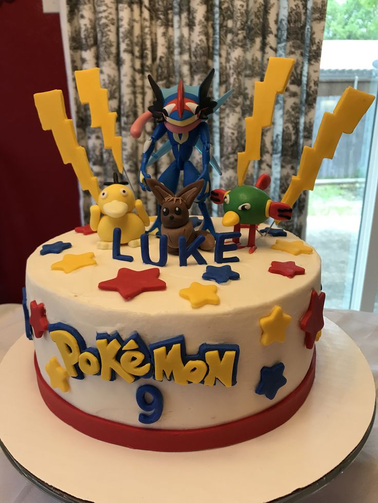 a birthday cake with pokemon characters on it