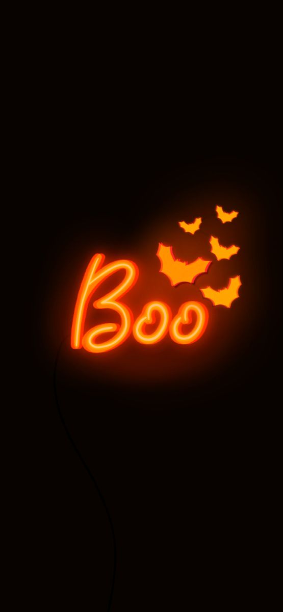 a neon sign that says boo with bats flying around it in the dark night sky