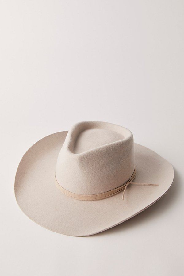 A classic cowboy hat featured in a soft wool felt fabrication and structured silhouette with an upturned brim and teardrop crown. **Features:** Soft wool felt fabrication, structured design, upturned brim, teardrop crown, classic cowboy silhouette **Why We ❤ It:** This effortlessly cool cowboy hat adds the perfect western-inspired touch to every outfit. | Walk The Line Cowboy Hat by Wyeth at Free People in White Curved Brim Fur Felt Fedora For Ranch, Fitted Felt Hat For Rodeo, Rigid Fedora Felt Hat For Ranch, Rigid Wide Brim Felt Hat For Ranch, Flat Brim Felt Hat For Ranch, Rigid Flat Brim Felt Hat For Country Events, Country Style Wool Fedora With Curved Brim, Wool Felt Hat With Flat Crown For Country Events, Curved Brim Felt Hat For Rodeo