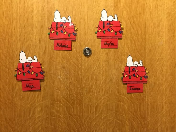 the door is decorated with snoopy christmas decorations