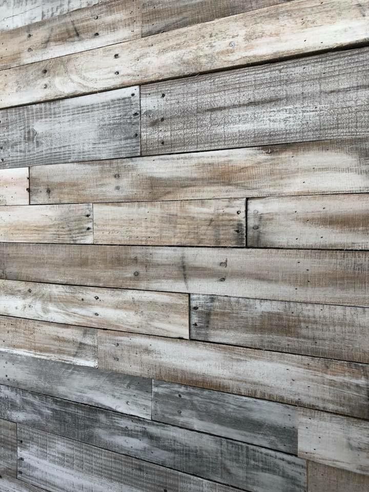 a wooden wall made out of multiple boards