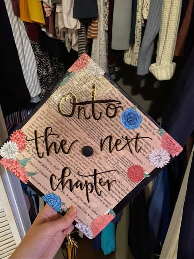 someone is holding up a graduation cap that says, onto the next chapter on it