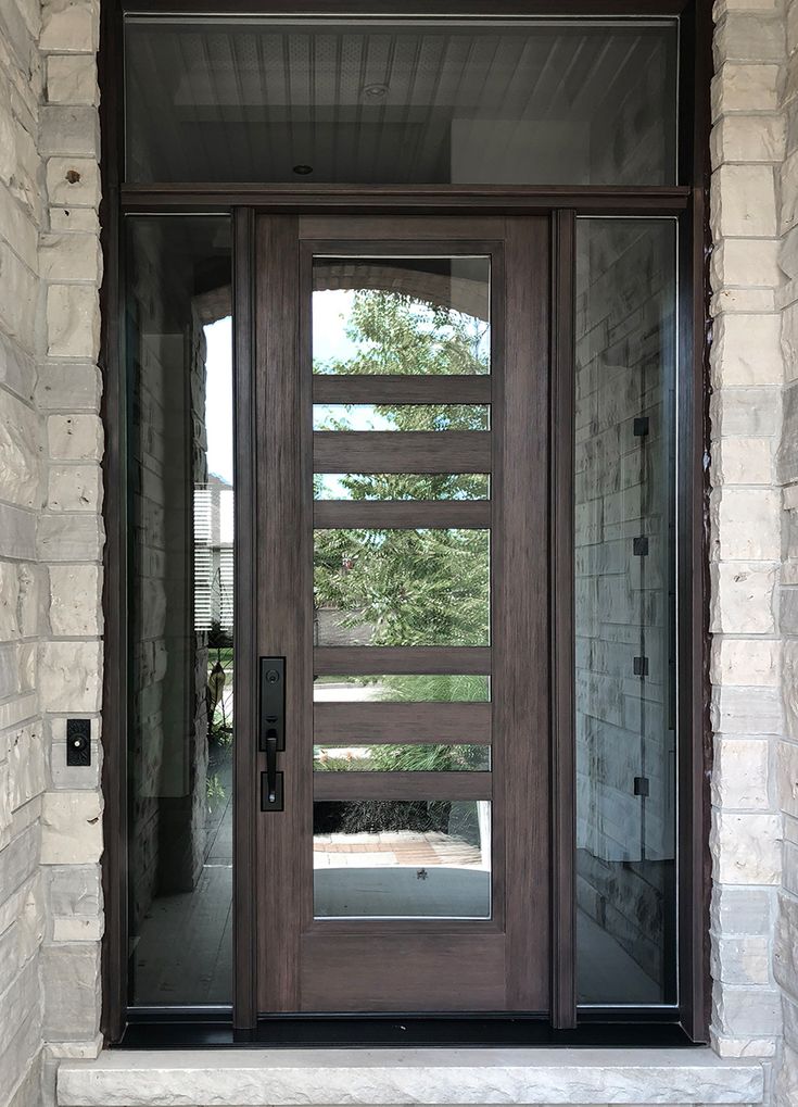 a wooden door with glass on the outside