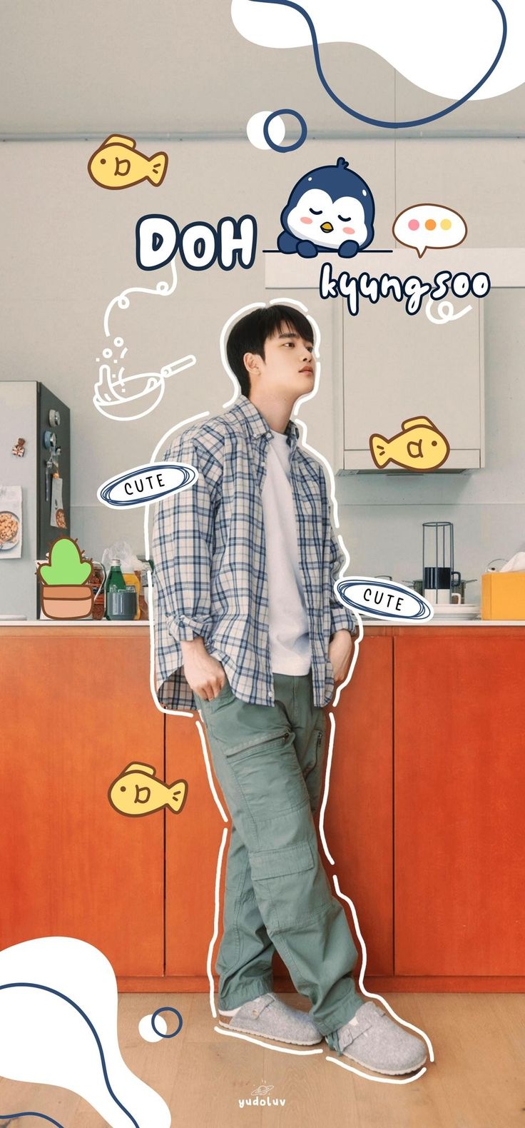 a man standing in front of a kitchen counter with stickers on the wall above him