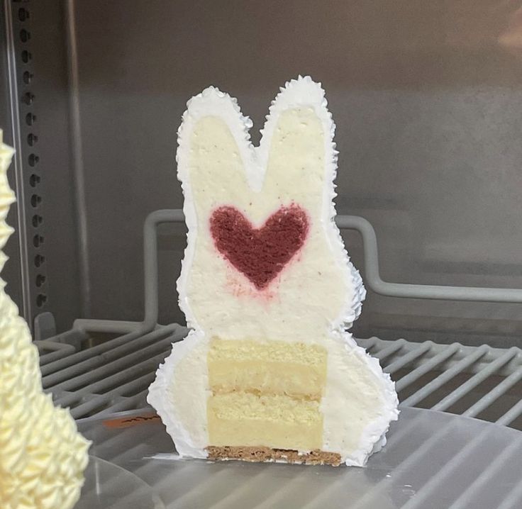 a piece of cake that has been decorated to look like an animal with a heart on it