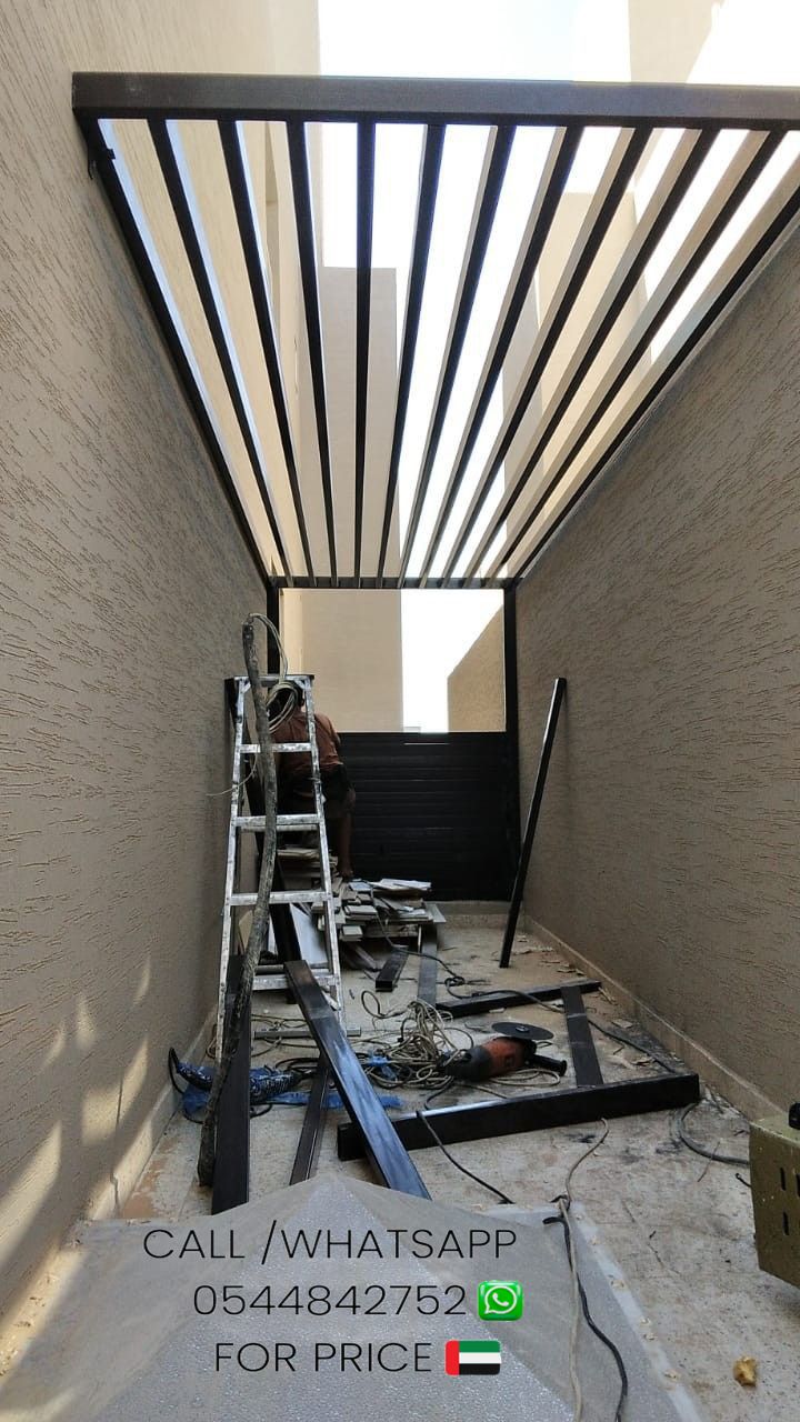 a ladder is in the process of being installed on an apartment building's roof