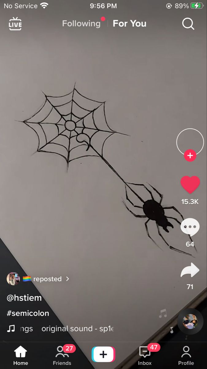 an image of a spider on the screen of a cell phone that is being viewed by someone