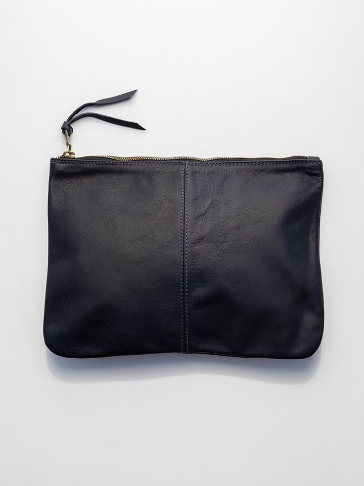 simple leather zip clutch with stitched center seam and leather zipper pull. measures approximately 10.5" x 8". made in california. erica tanov Minimalist Leather Clutch Pouch, Minimalist Leather Pouch, Everyday Leather Clutch With Zipper Pouch, Versatile Leather Clutch With Zipper Closure, Leather Clutch With Zipper Closure For Everyday Use, Versatile Leather Clutch For Work, Minimalist Leather Clutch, Versatile Leather Clutch With Zipper Pocket, Erica Tanov