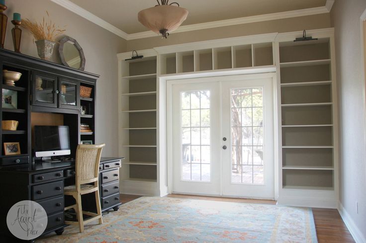 an empty room with a large white tub in it