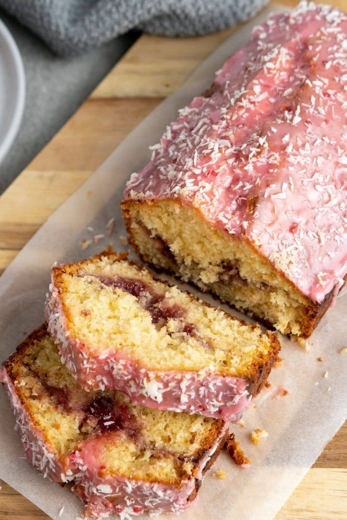 a loaf of cake sitting on top of a wooden cutting board