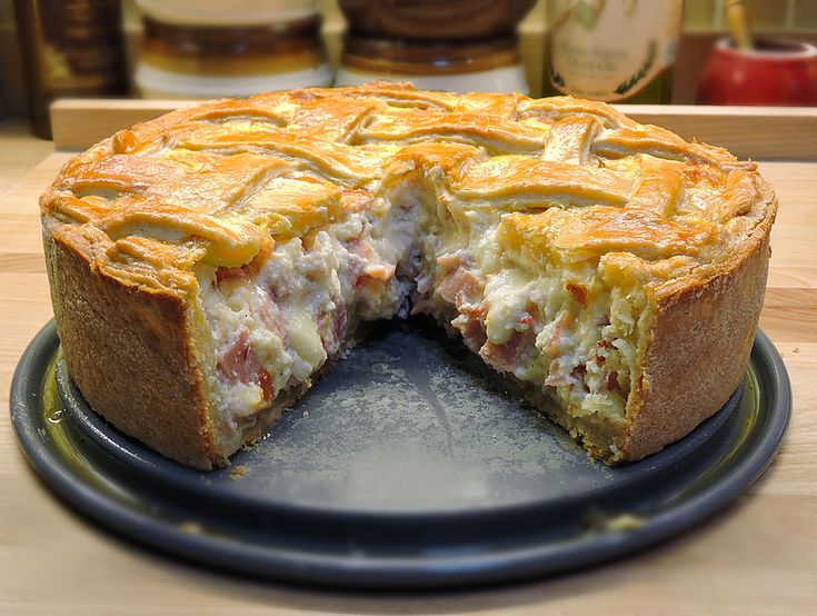 there is a pie that has been cut in half on the plate and ready to be eaten