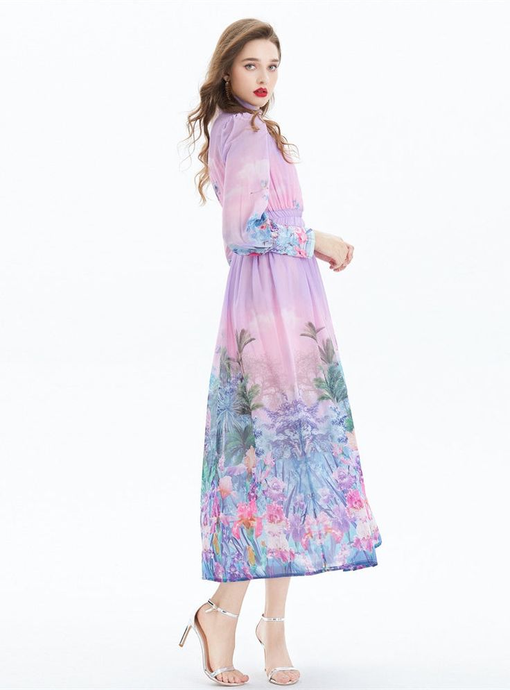 Oasis-like in its serene palette, this dress is a breath of fresh air with its fluid, pastel tones and delicate floral imagery. A vision of springtime charm, the high collar and long sleeves offer a dignified silhouette, while the gentle gathering at the waist cascades into a flowy skirt that dances around the calves. Each brushstroke of the print evokes a dreamy garden, with flowers in bloom and exotic birds in mid-flight, transforming the fabric into a wearable piece of art. Fastened with a neat row of buttons along the bodice and wrists, this dress marries simplicity with sophistication. Ideal for daytime events or enchanting evenings, it's a statement garment that doesn't shout but rather, whispers elegance. Fabric name: chiffonPattern: printingSleeve length: long sleevesMain fabric co Garden With Flowers, Simple Belt, Dreamy Garden, Flowers In Bloom, Exotic Birds, Breath Of Fresh Air, Holiday Dress, Flowy Skirt, Blooming Flowers