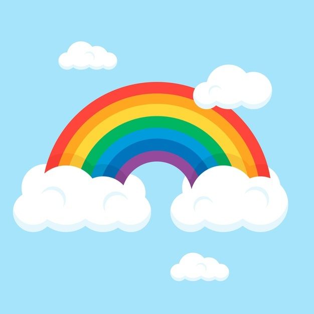 a rainbow in the sky with clouds