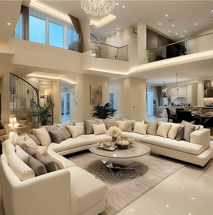 a living room filled with lots of white furniture