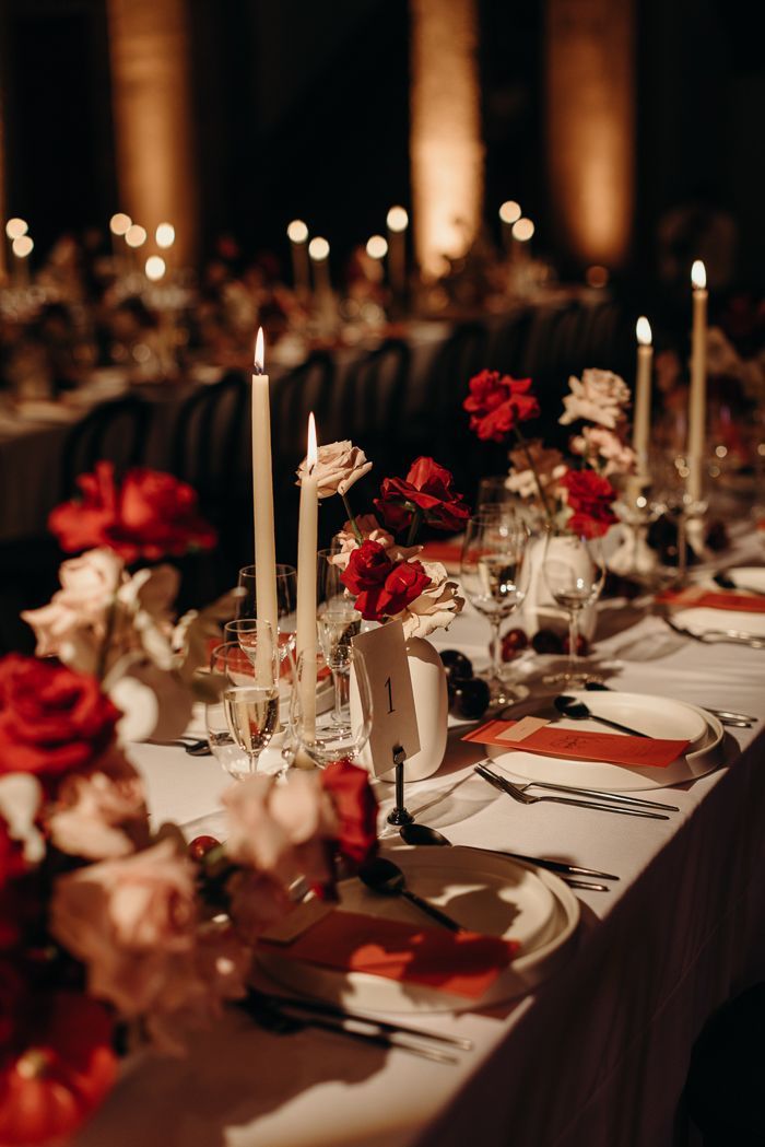 a long table is set with candles and flowers for a formal dinner or party event