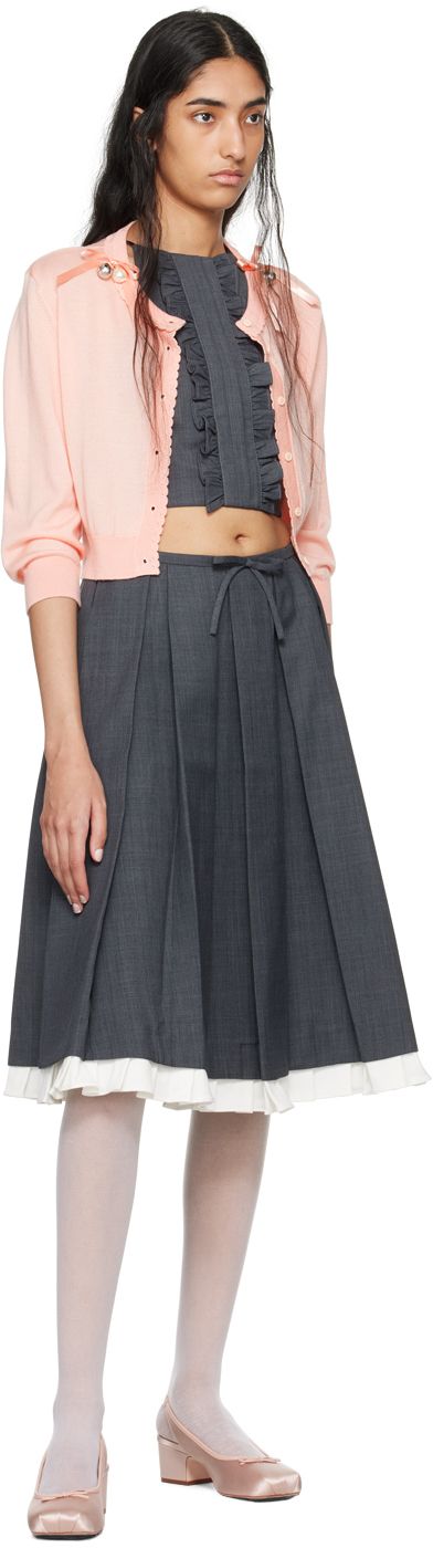 Polyester- and wool-blend delaine skirt. Box pleats throughout. · Bow accent at front waistband · Pleated stretch twill trim at hem · Concealed zip closure at side · Bonded jersey lining Supplier color: Gray Wool Midi Skirt For Workwear, Elegant Wool Pleated Skirt For Work, Fitted Belted Pleated Skirt For Work, Spring Formal Wool Skirt, Formal Wool Skirt For Spring, Formal Spring Wool Skirt, Fall Workwear Belted Pleated Skirt, Elegant Waist-length Pleated Skirt, Wool Pleated Office Skirt